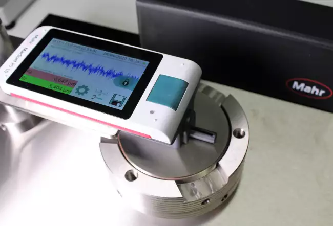 gibitre instruments: Device for Compression Set. Measurement of surface roughness with Mahr roughness tester.